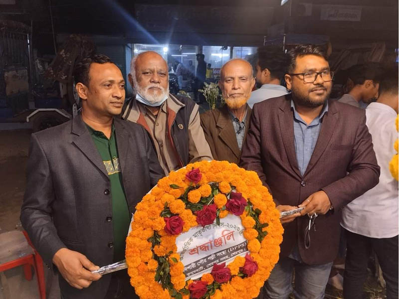 Commemoration of language martyrs with floral tributes